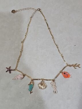 Gold Seashell Charm Necklace with Orange Fish and Turquoise Accents